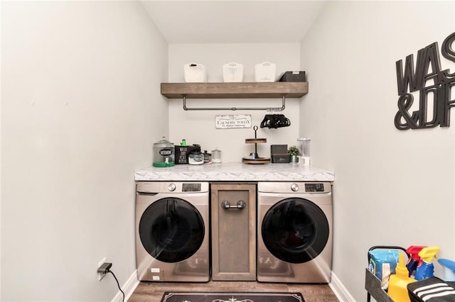 laundry room with washing machine and clothes dryer