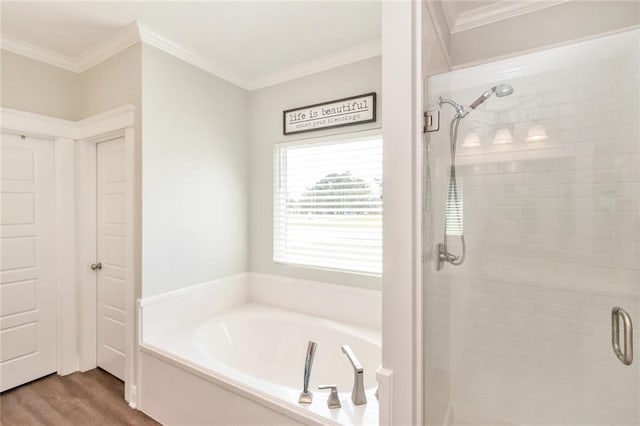 bathroom with independent shower and bath, wood-type flooring, and ornamental molding