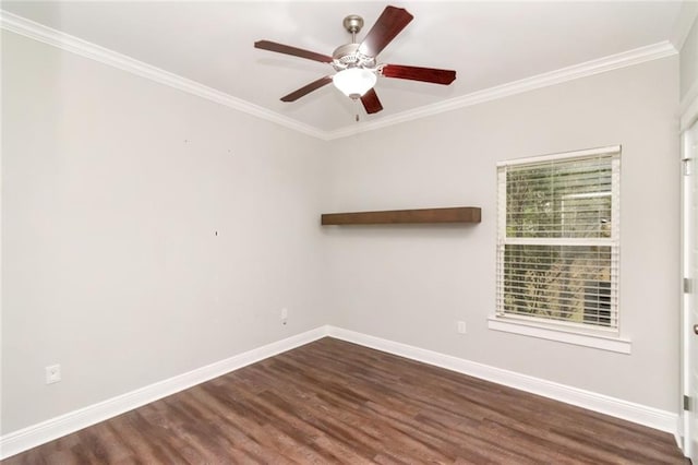 spare room featuring dark wood-type flooring, ceiling fan, and crown molding