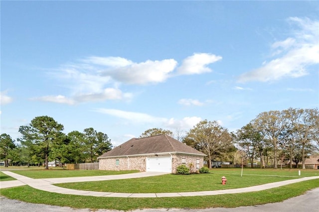 view of side of home with a lawn