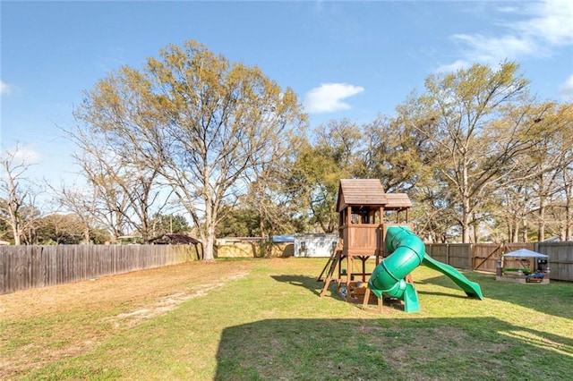 view of jungle gym with a yard