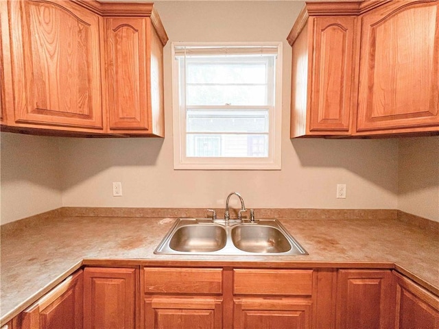 kitchen with light countertops and a sink