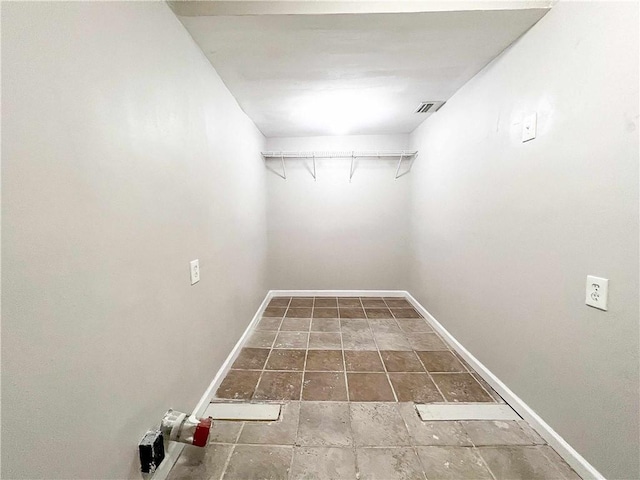 interior space with visible vents and baseboards