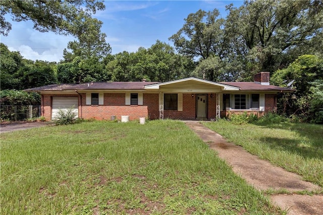 1259 Marietta Dr W, Mobile, AL 36618 - ranch-style home with an attached garage, a chimney, driveway, brick siding, and a front lawn