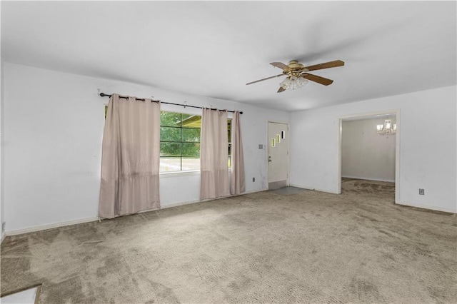 1259 Marietta Dr W, Mobile, AL 36618 - empty room with a ceiling fan, a chandelier, and carpet flooring