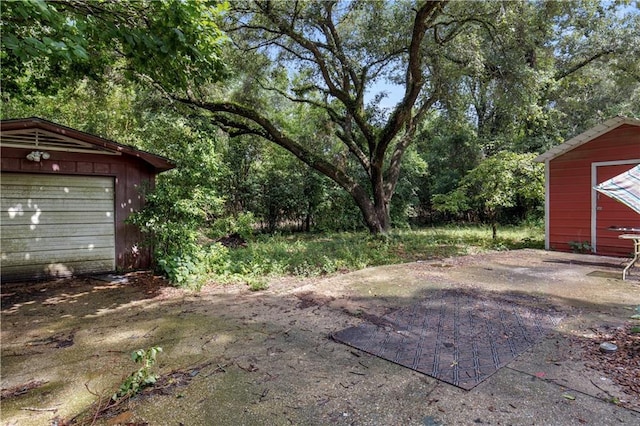 1259 Marietta Dr W, Mobile, AL 36618 - view of yard with an outbuilding and a garage