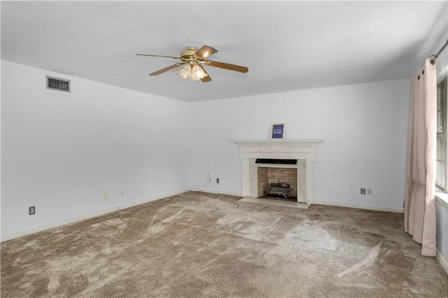 1259 Marietta Dr W, Mobile, AL 36618 - unfurnished living room with ceiling fan, carpet floors, and a fireplace with flush hearth