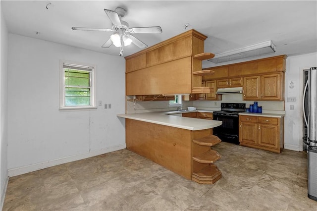 1259 Marietta Dr W, Mobile, AL 36618 - kitchen with open shelves, black / electric stove, under cabinet range hood, a peninsula, and light countertops