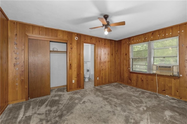 1259 Marietta Dr W, Mobile, AL 36618 - unfurnished bedroom featuring carpet floors, cooling unit, wood walls, ensuite bathroom, and ceiling fan