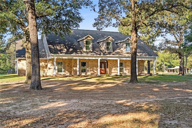 cape cod-style house with a porch