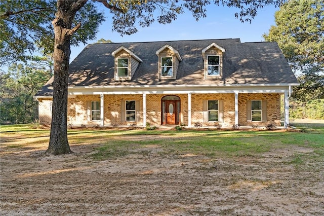 new england style home with a porch