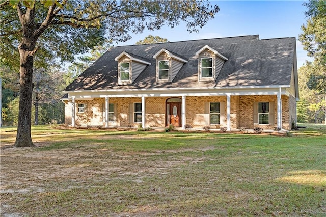 cape cod-style house featuring a front lawn