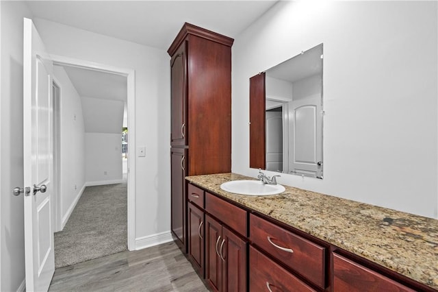 bathroom featuring vanity and hardwood / wood-style flooring