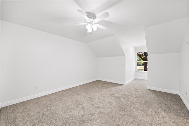 bonus room with ceiling fan, light carpet, and lofted ceiling