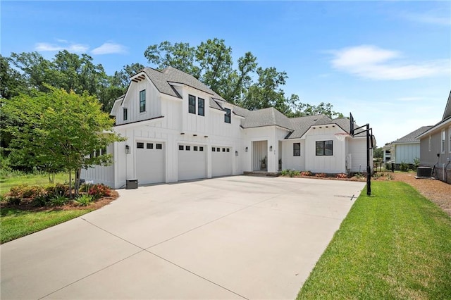 313 Cuban Lilly Dr, Fairhope, AL 36532 - modern farmhouse featuring board and batten siding, concrete driveway, an attached garage, a front lawn, and roof with shingles