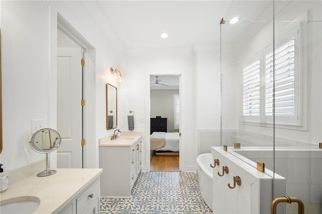 313 Cuban Lilly Dr, Fairhope, AL 36532 - ensuite bathroom featuring tile patterned floors, a soaking tub, vanity, a shower stall, and a ceiling fan