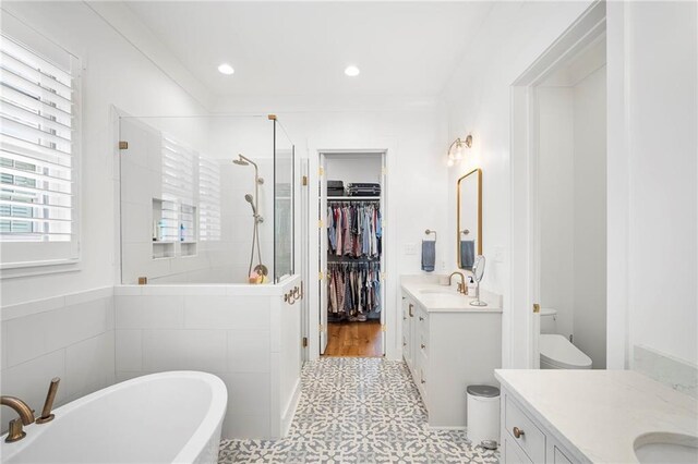313 Cuban Lilly Dr, Fairhope, AL 36532 - bathroom featuring vanity, a stall shower, tile patterned floors, toilet, and a freestanding bath