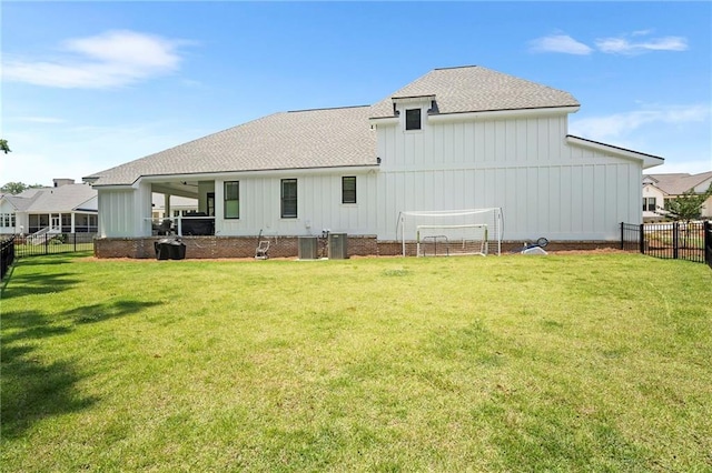 313 Cuban Lilly Dr, Fairhope, AL 36532 - back of house with roof with shingles, board and batten siding, and central AC