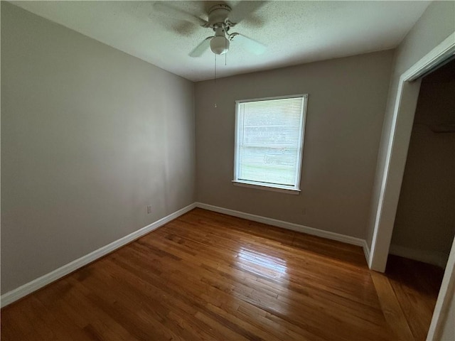6 Elizabeth Ave, Chickasaw, AL 36611 - unfurnished bedroom featuring wood finished floors, a closet, and ceiling fan
