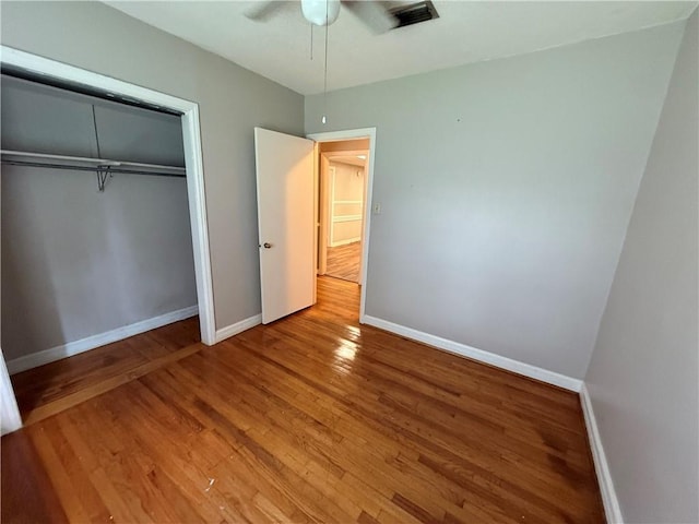 6 Elizabeth Ave, Chickasaw, AL 36611 - unfurnished bedroom with light wood-style floors, a closet, and ceiling fan