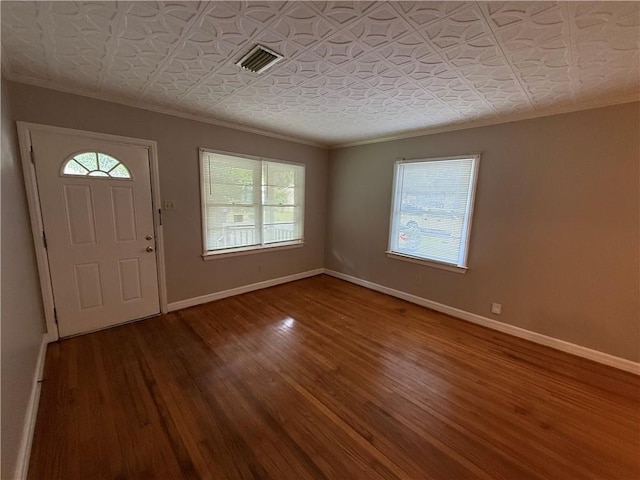 6 Elizabeth Ave, Chickasaw, AL 36611 - entryway featuring crown molding, plenty of natural light, wood finished floors, and an ornate ceiling