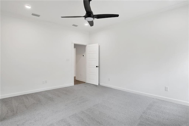 unfurnished room featuring visible vents, baseboards, ceiling fan, and carpet flooring
