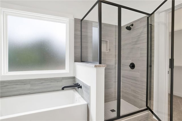 full bathroom with a garden tub and a stall shower