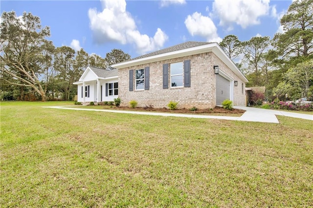 ranch-style home with a garage, brick siding, concrete driveway, and a front yard
