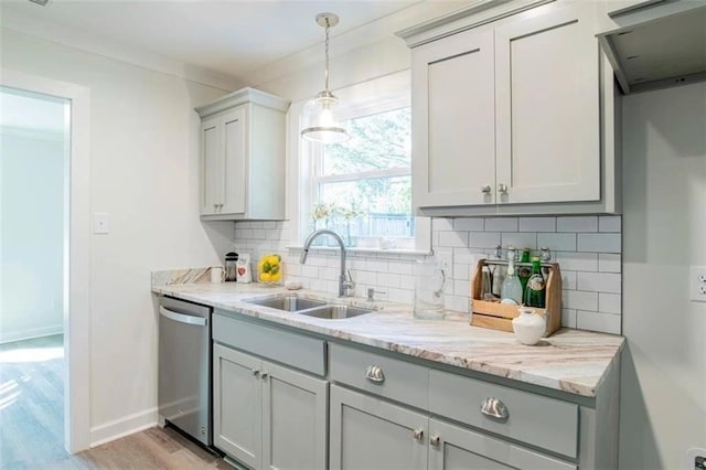 2305 Cedar Ky, Mobile, AL 36695 - kitchen featuring light stone countertops, decorative backsplash, a sink, and dishwasher