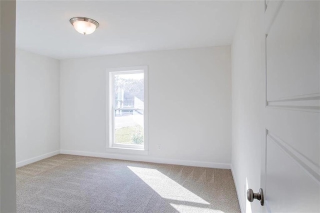 empty room with light colored carpet