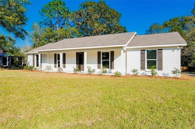 2305 Cedar Ky, Mobile, AL 36695 - ranch-style house with brick siding, a shingled roof, a front lawn, and a porch
