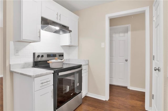 kitchen with tasteful backsplash, stainless steel electric range, white cabinets, and under cabinet range hood