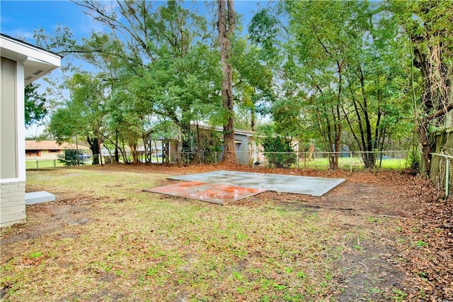 view of yard featuring a patio area and a fenced backyard