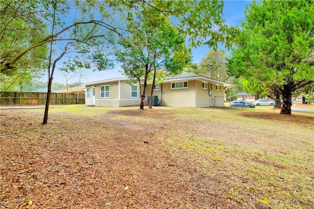 exterior space with a yard and fence