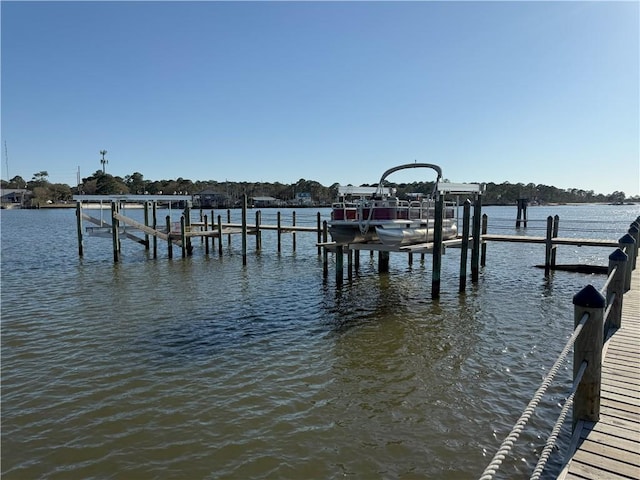 dock area featuring a water view and boat lift