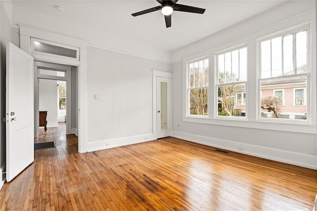 unfurnished room featuring ceiling fan and wood-type flooring