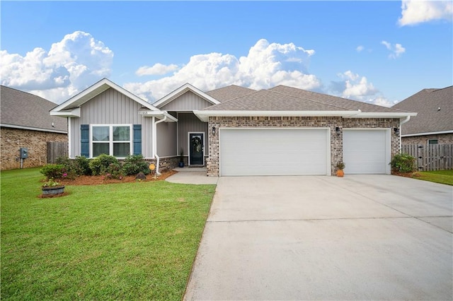 view of front of property featuring a front lawn and a garage