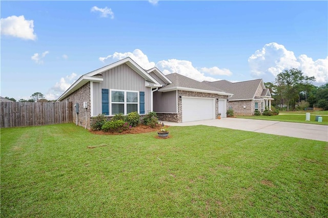 view of front of home featuring a front yard and a garage