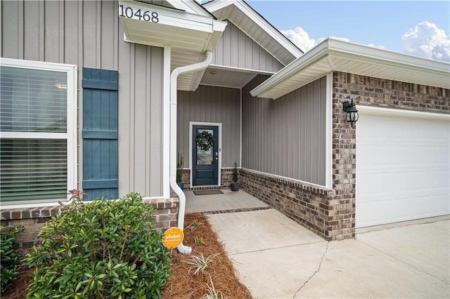 doorway to property featuring a garage