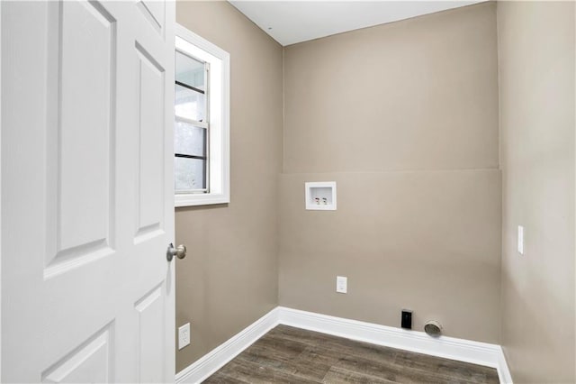 clothes washing area with dark hardwood / wood-style flooring and hookup for a washing machine