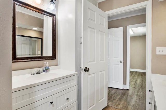 bathroom with vanity and wood-type flooring