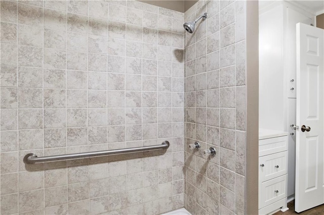 bathroom with a tile shower