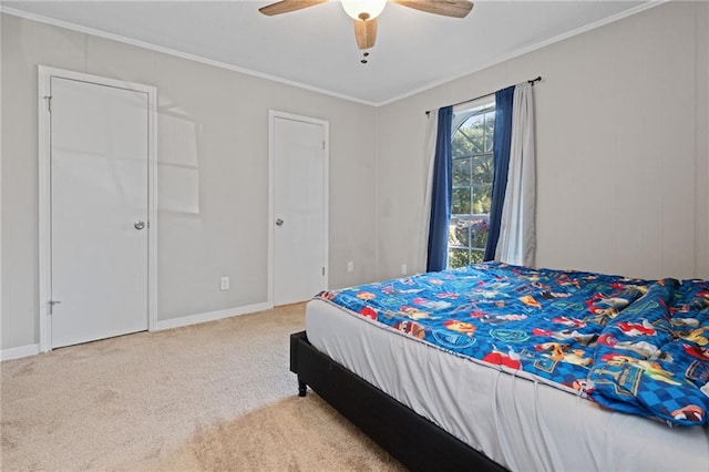 bedroom with carpet flooring, ceiling fan, and ornamental molding