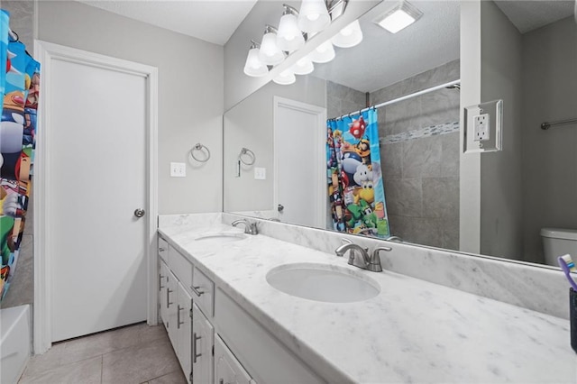 bathroom featuring tile patterned flooring, vanity, and shower / tub combo with curtain