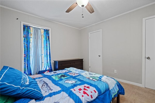 bedroom with carpet flooring, a textured ceiling, ceiling fan, and crown molding