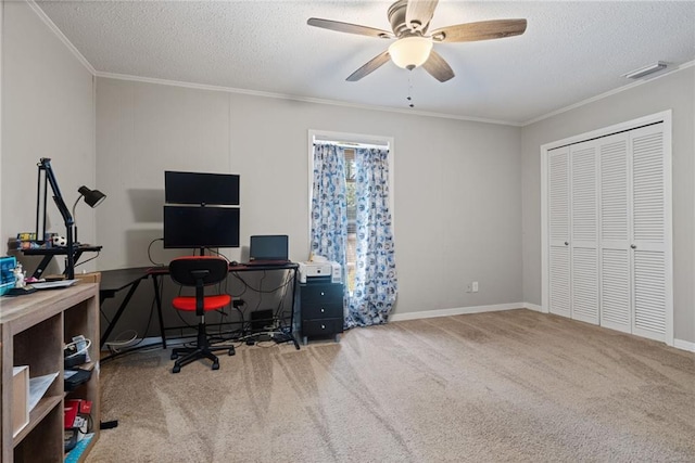 carpeted office space with ceiling fan, ornamental molding, and a textured ceiling