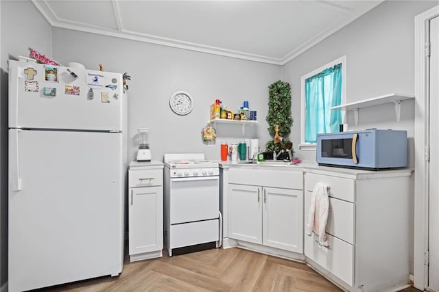 kitchen featuring white cabinetry, sink, light parquet floors, and white appliances