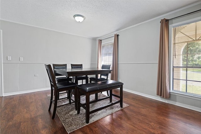 dining area with a wealth of natural light, dark hardwood / wood-style flooring, and crown molding