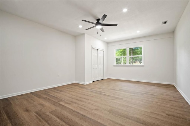3001 Demetropolis Rd, Mobile, AL 36693 - unfurnished bedroom with baseboards, recessed lighting, wood finished floors, and visible vents