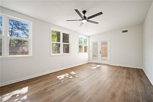 3001 Demetropolis Rd, Mobile, AL 36693 - empty room with ceiling fan, french doors, baseboards, wood finished floors, and visible vents